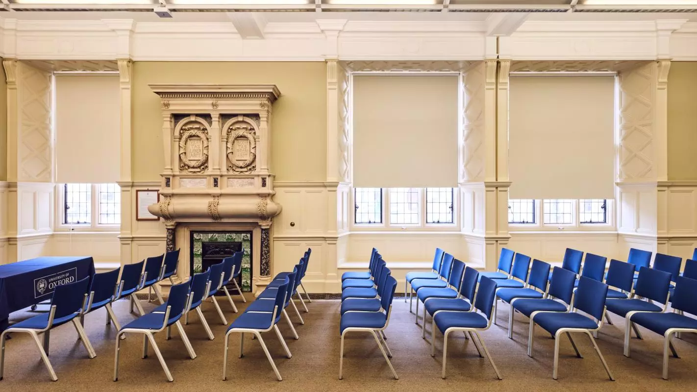 Room 6 at the Examination Schools facing the windows with rows of chairs