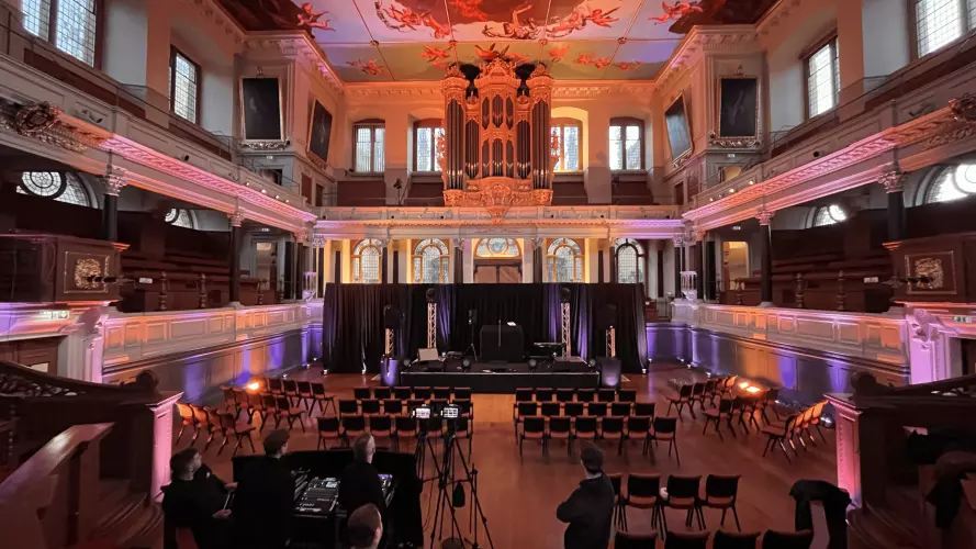 New lighting in the Sheldonian Theatre casting a peach coloured light over the theatre