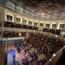 Stephen Fry on stage at the Sheldonian giving a talk to a sold out audience.