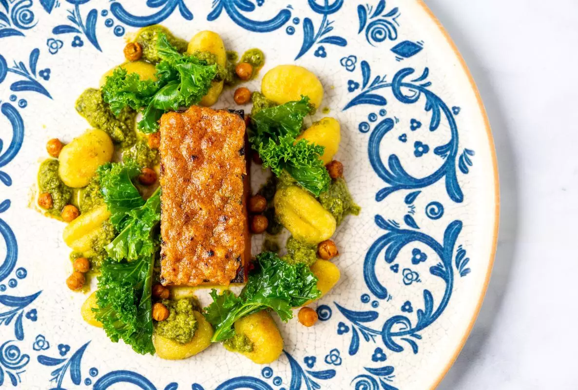 a meal with roasted butternut squash, gnocchi cand pesto